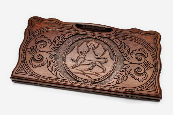 Carved beechwood backgammon board with the Ossetian coat of arms and a carry handle, propped open