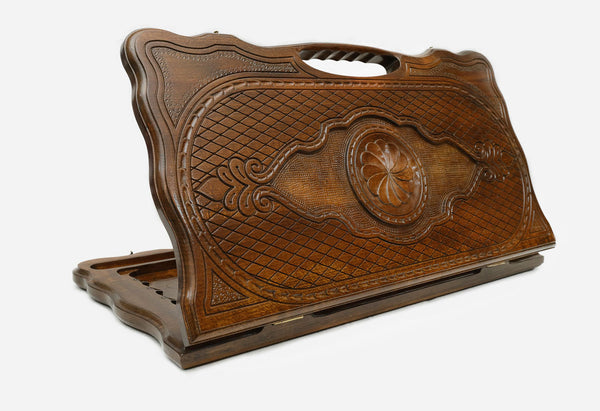 Carved beechwood backgammon board with the Armenian eternity sign among ornaments, propped open