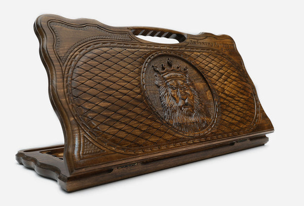 Carved beechwood backgammon board with a crowned lion and a carry handle, propped open