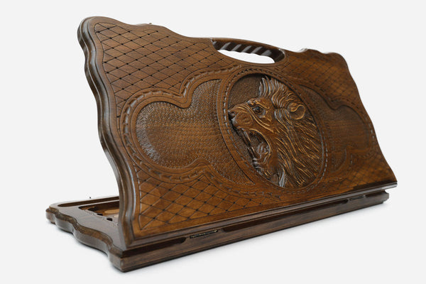 Carved beechwood backgammon board with a roaring lion and a carry handle, propped open