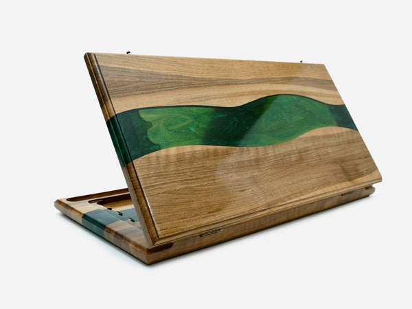 Folding board with a green epoxy chessboard face and basket-weave carved panels, shown closed at an angle