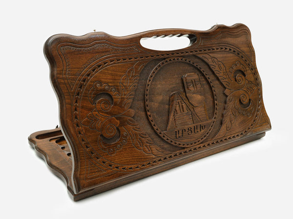 Carved Armenian backgammon board with the Tatik and Papik monument of Artsakh and a cut-out carry handle, propped open