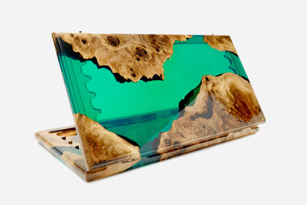 Folding backgammon board with emerald-green river epoxy flowing between live-edge walnut wood, standing open