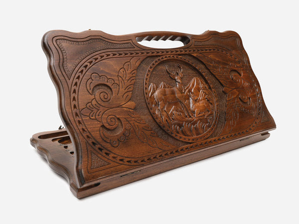 Carved beechwood backgammon board with a pair of stags and a carry handle, propped open