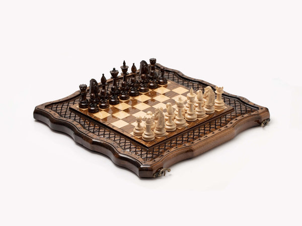 Carved wooden chess set with hand-carved pieces arranged on the board