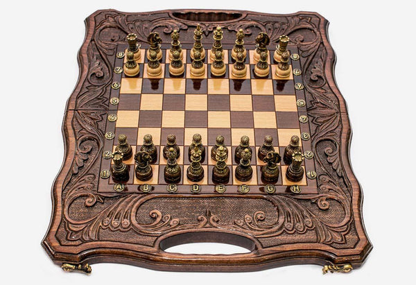 Luxury walnut chess backgammon set with deeply carved borders and an ornate bronze chess army set up for play