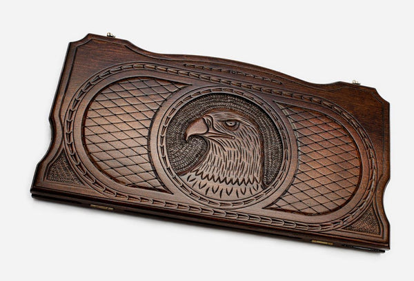 Hand-carved eagle on wooden backgammon set lid