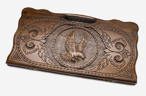 Carved beechwood backgammon board with a proud eagle and carry handle, propped open