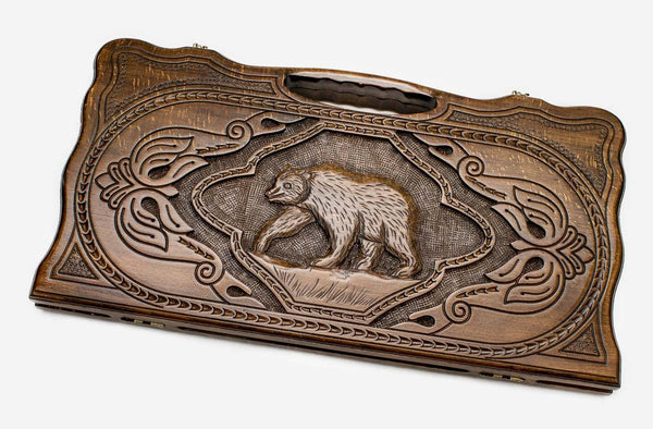 Carved beechwood backgammon board with a bold bear, propped open