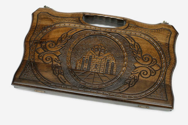 Compact carved backgammon board with the Saint Hripsime Church and a carry handle, propped open