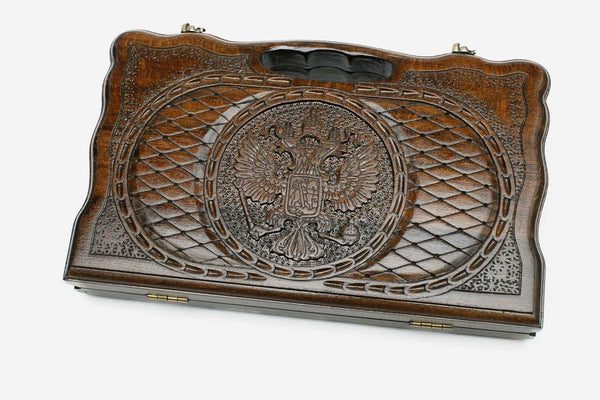 Compact carved backgammon board with the Russian coat of arms and a carry handle, propped open