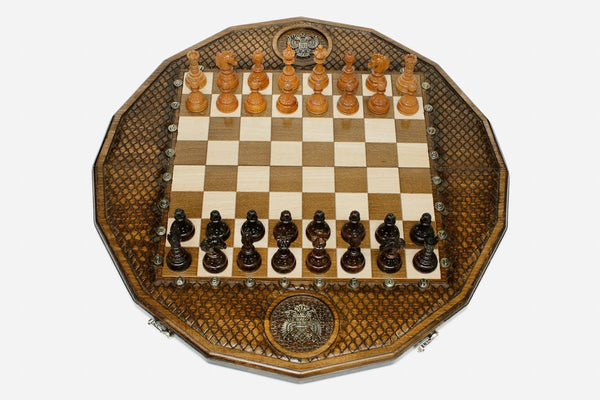 Luxury twelve-sided Russian chess set with an inlaid double-headed eagle and turned wooden pieces set up for play