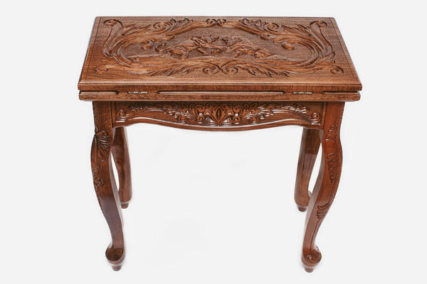 Facing lions backgammon table closed, front elevation showing the carved lid and legs