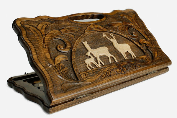 Carved beechwood backgammon board with a pair of deer in an oval frame, propped open