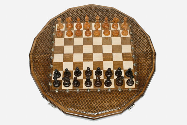 Luxury sixteen-sided chess set with lattice-carved borders and turned wooden pieces set up for play