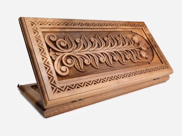 Master-carved walnut backgammon board with a deep-relief Tree of Life and a carry handle, propped open
