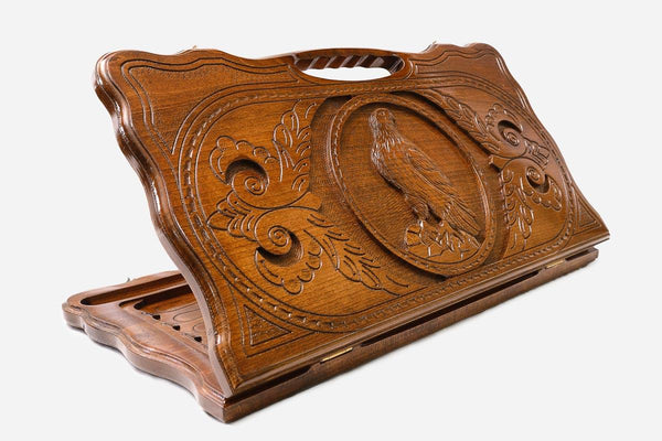Carved beechwood backgammon board with a perched eagle and a carry handle, propped open