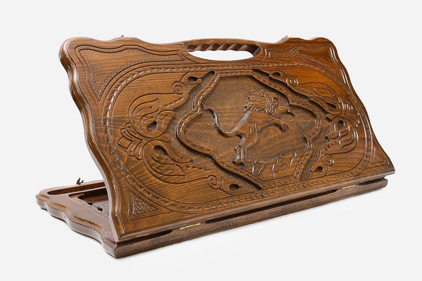 Carved beechwood backgammon board with a regal lion and a carry handle, propped open