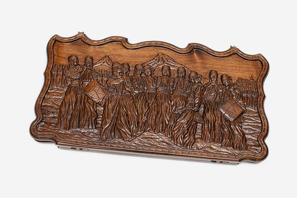 Walnut backgammon board carved in deep relief with the victory Dance of Sasun, propped open