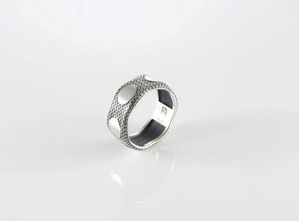 Men’s sterling silver textured ring with brushed oval detail
