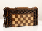 Wooden chess set folded showing the carved cover