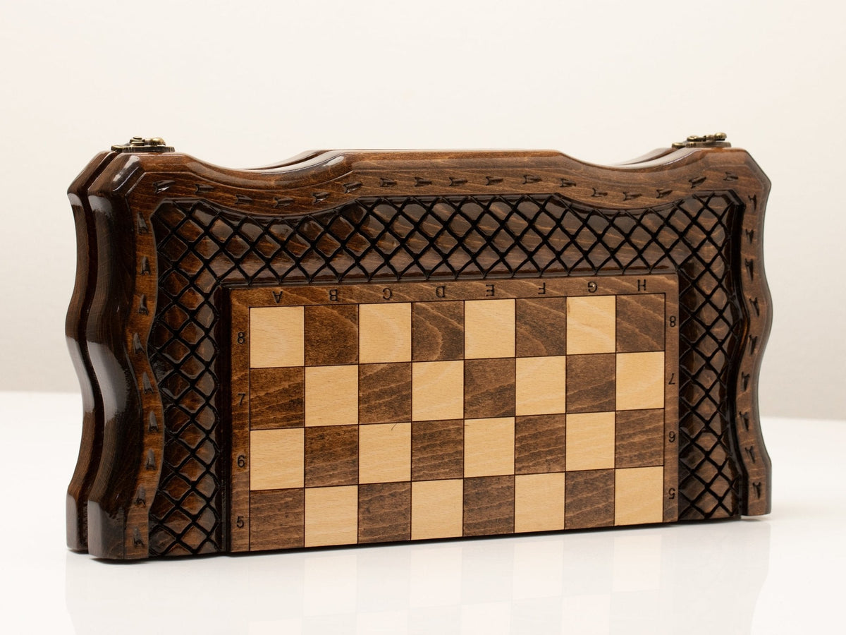 Wooden chess set folded showing the carved cover