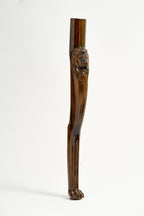 Carved lion-head leg detail of the regal chess table