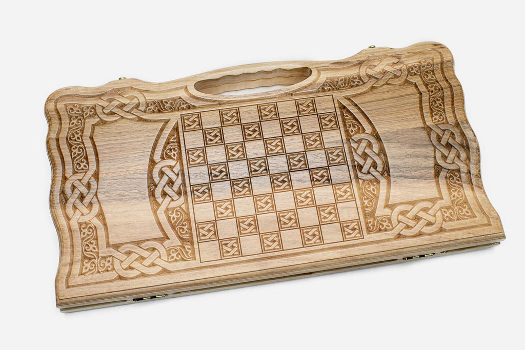 Angled view of the fully carved interlace backgammon board