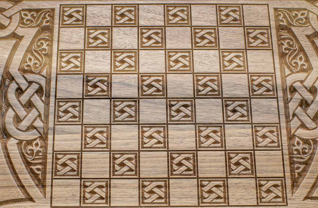The backgammon board opened to show the wooden playing surface