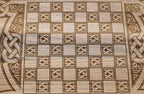 The backgammon board opened to show the wooden playing surface