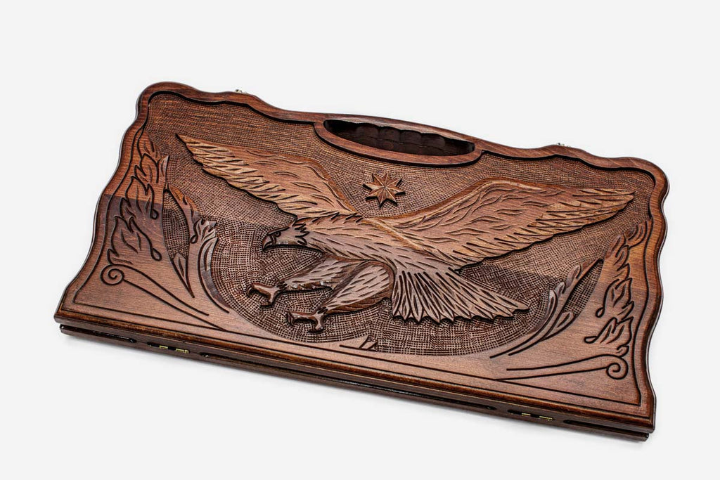Carved beechwood backgammon board with a soaring eagle and a carry handle, propped open