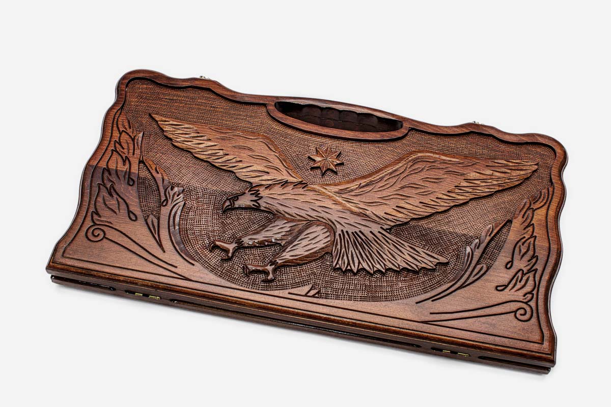 Carved beechwood backgammon board with a soaring eagle and a carry handle, propped open