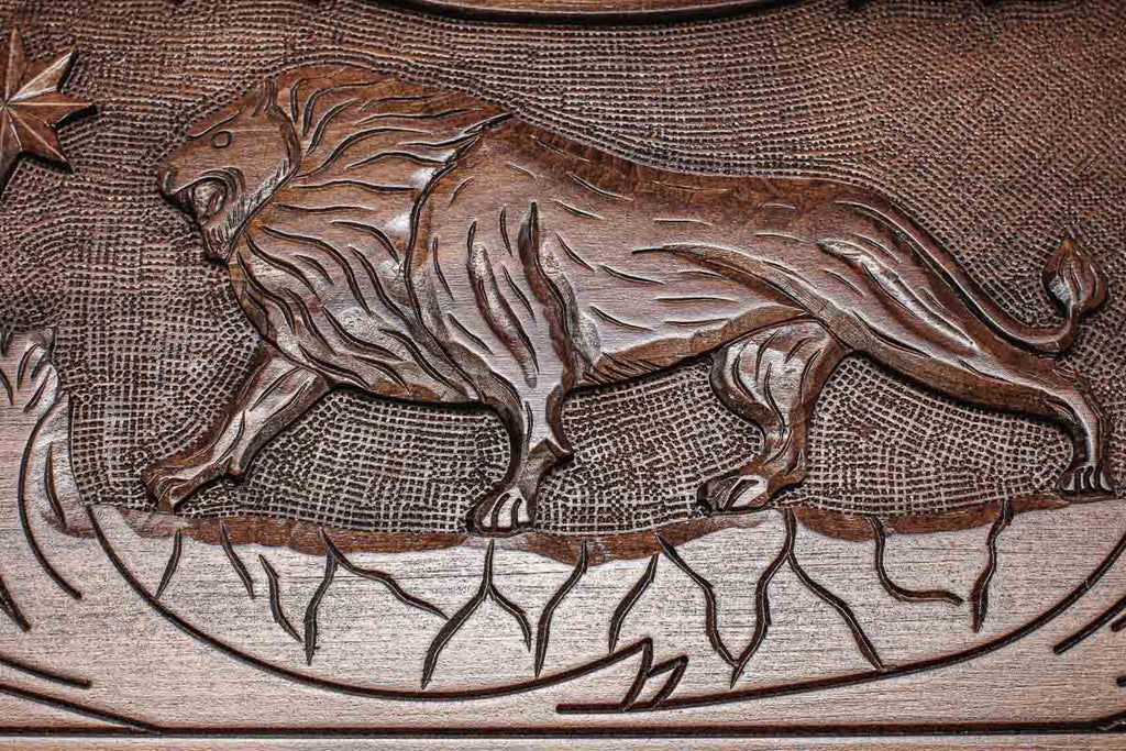 Angled view of the eagle and lion carved backgammon board
