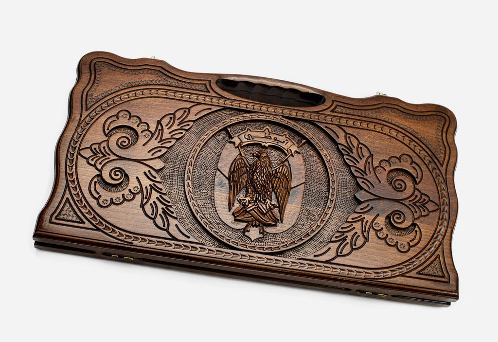 Carved beechwood backgammon board with the coat of arms of Dubai and a carry handle, propped open