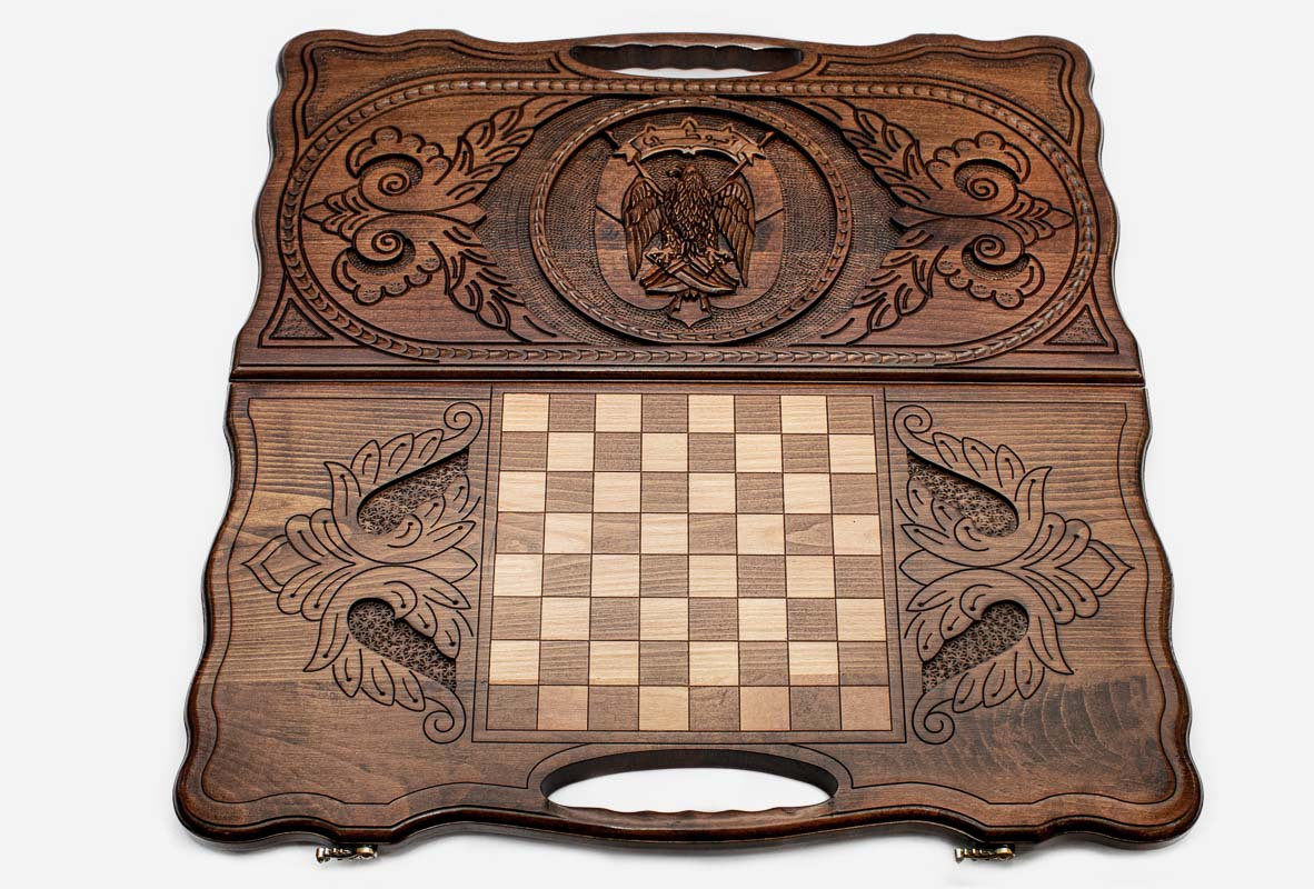 Angled view of the Dubai coat of arms carved backgammon board