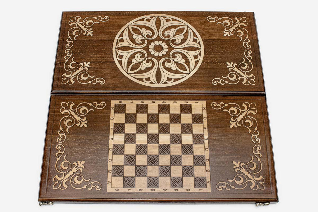 Close-up of the carved Armenian ornament lifted pale against the wood