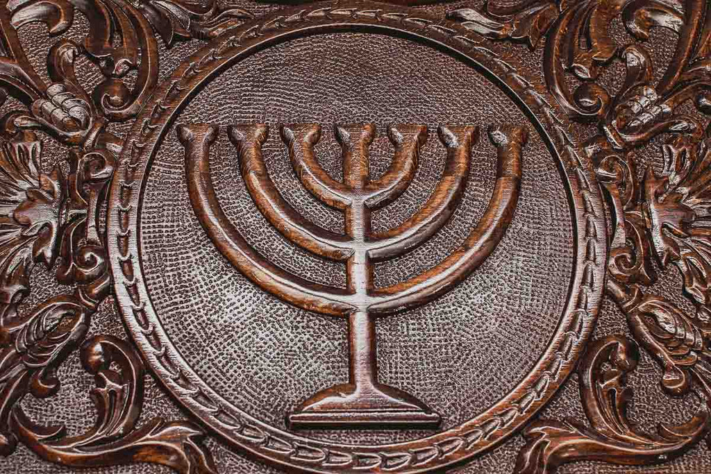 Angled view of the Menorah and Star of David carved backgammon board