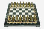 Green and cream marble chess set with hand-cast bronze pieces arranged for play and brass coordinate markers