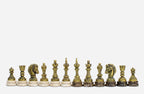 Row of the two-tone bronze chess pieces on marble bases, showing kings, queens, bishops and horse-head knights