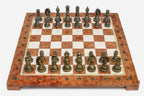Coral and cream marble chess set with hand-cast bronze pieces arranged for play and brass coordinate markers