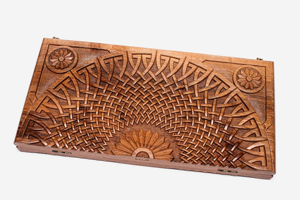 Close-up of the deep walnut carving