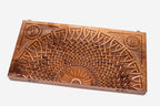 Close-up of the deep walnut carving