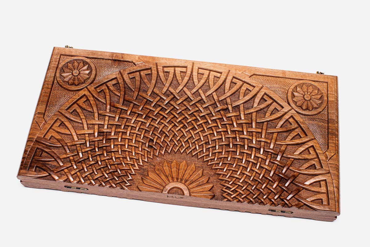 Close-up of the deep walnut carving