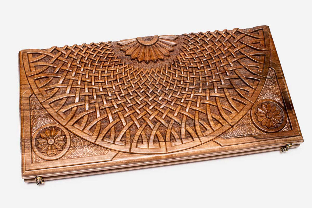 The backgammon board opened to show the wooden playing surface
