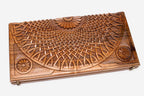 The backgammon board opened to show the wooden playing surface