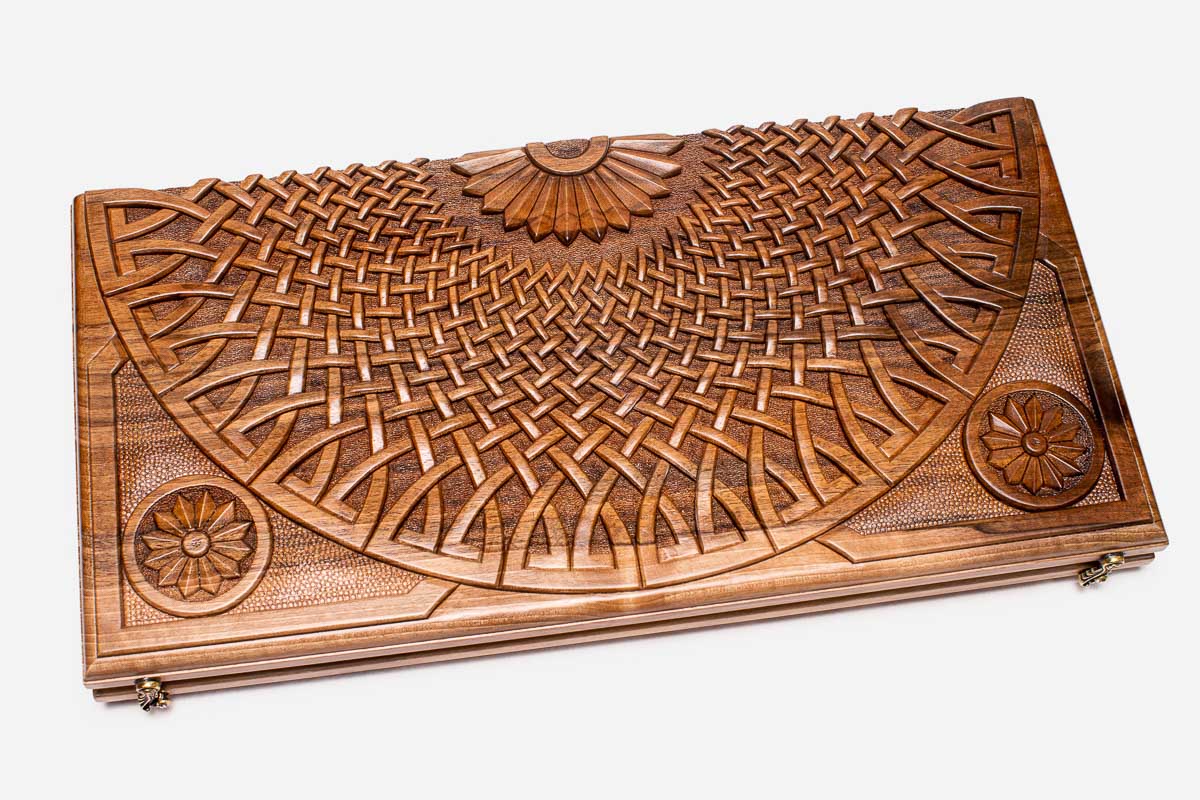 The backgammon board opened to show the wooden playing surface