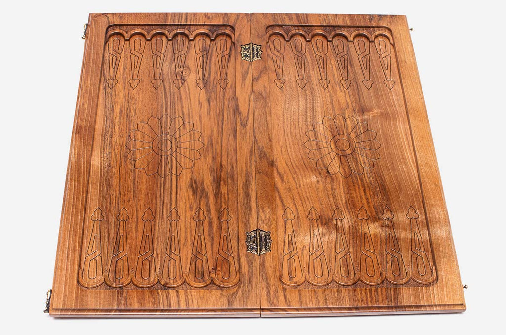 A carved ornament at the corner of the board