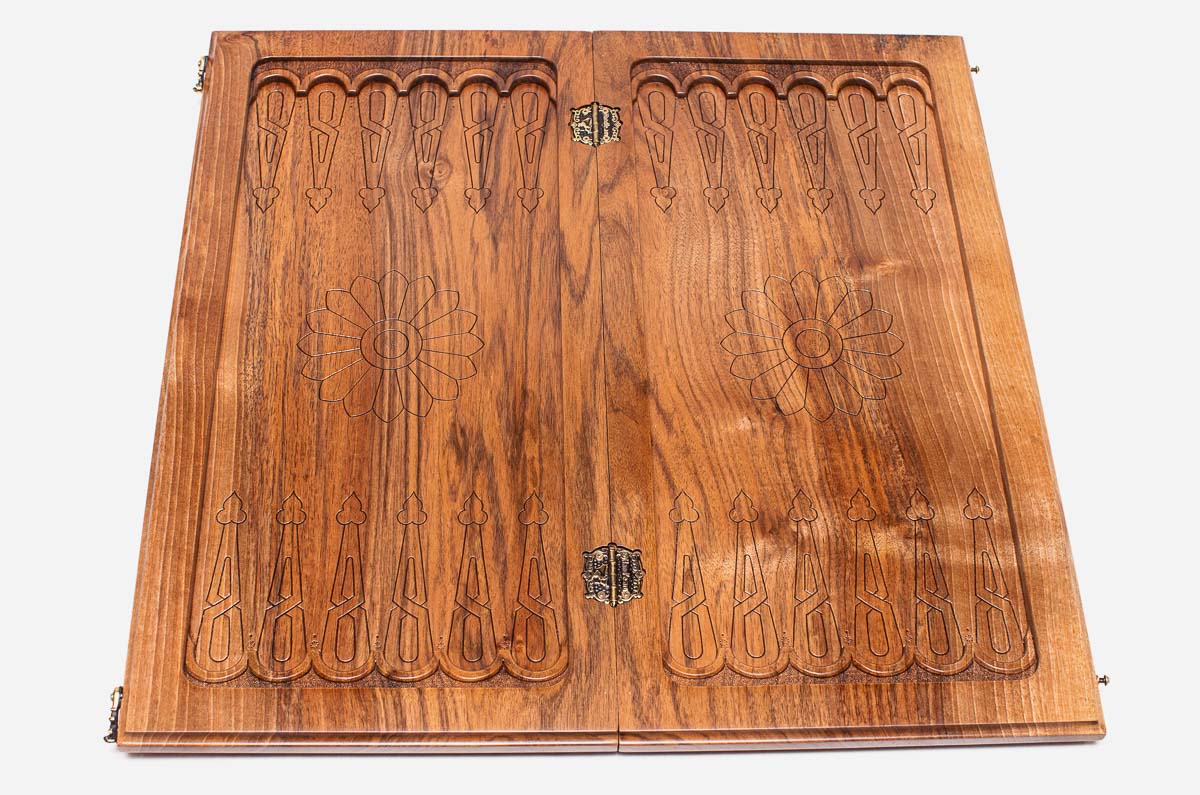 A carved ornament at the corner of the board