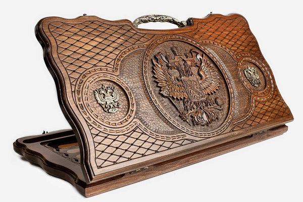 Carved beechwood backgammon board with the Russian coat of arms, bronze eagles and an ornate bronze handle, propped open