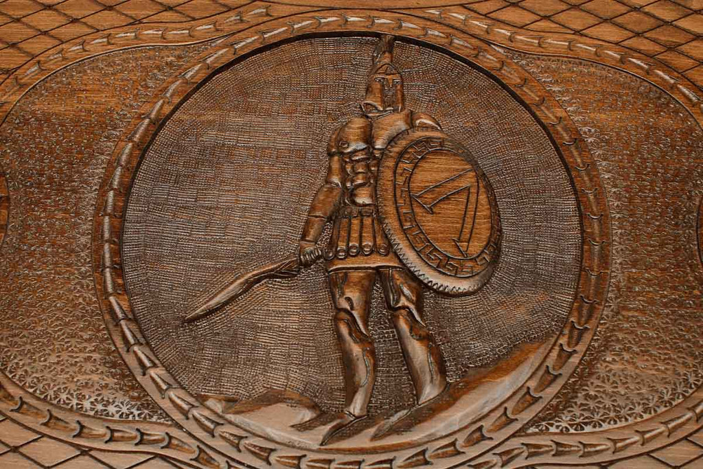 Angled view of the Spartan warrior carved backgammon board